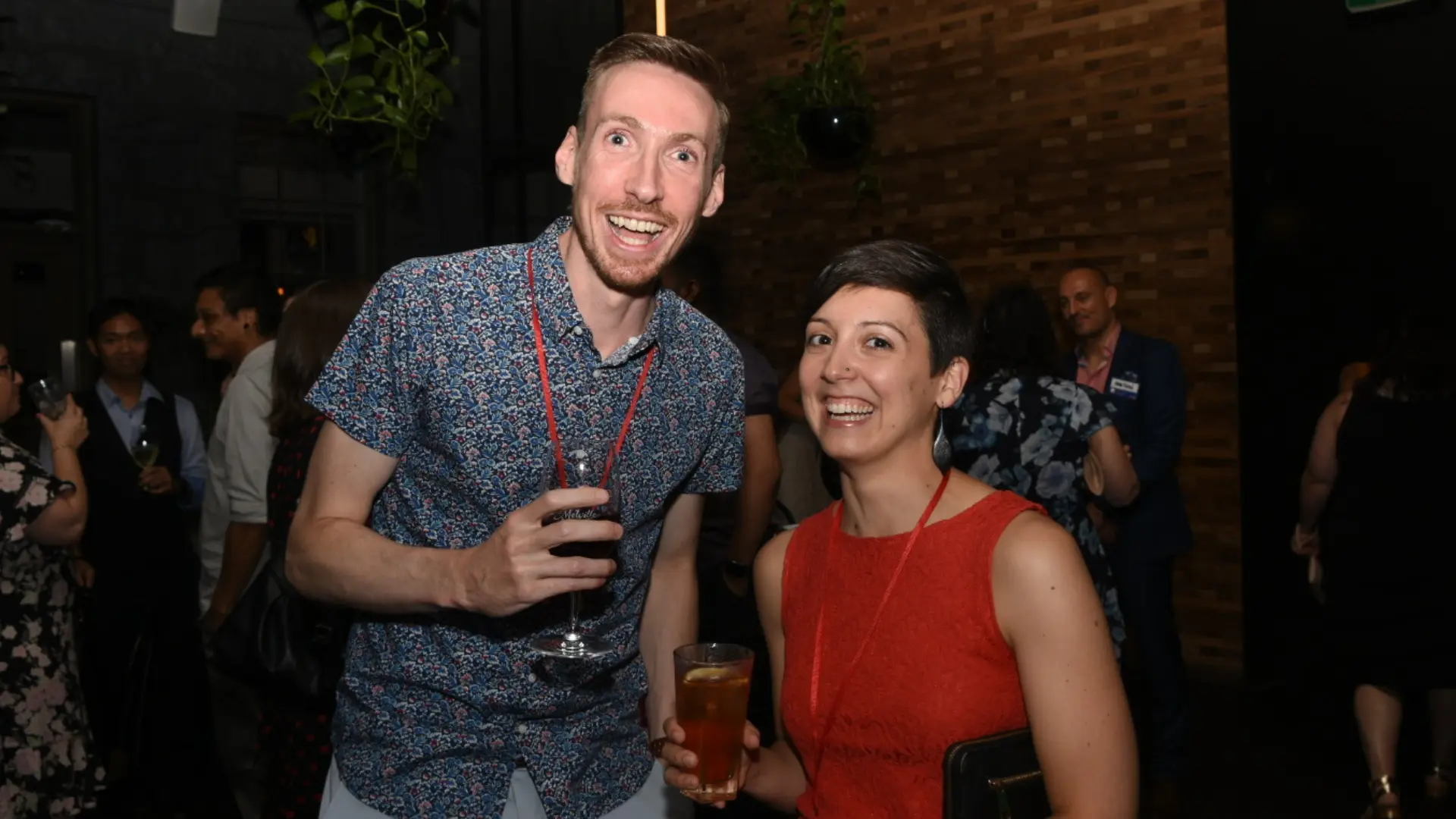 Two singles laughing together over drinks at an Offline Valentine event by Mojo Mingle in Melbourne