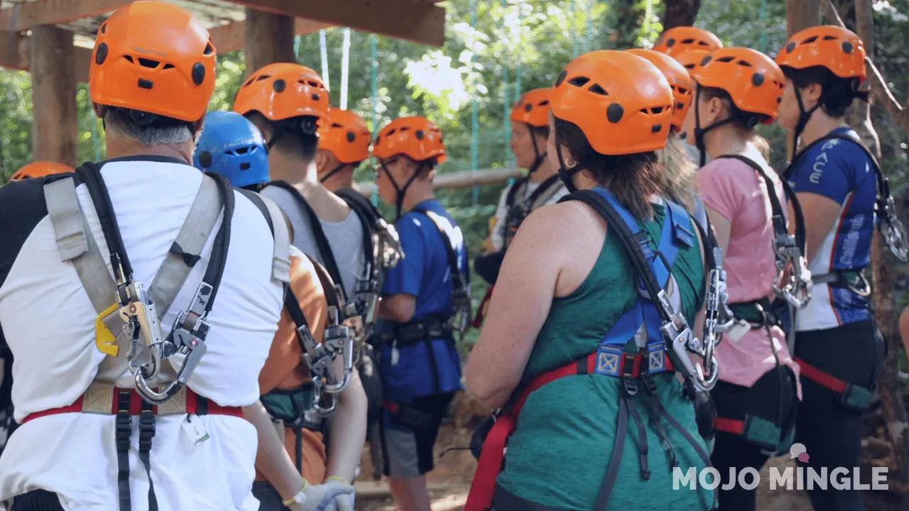 Singles group on a treetop ropes course